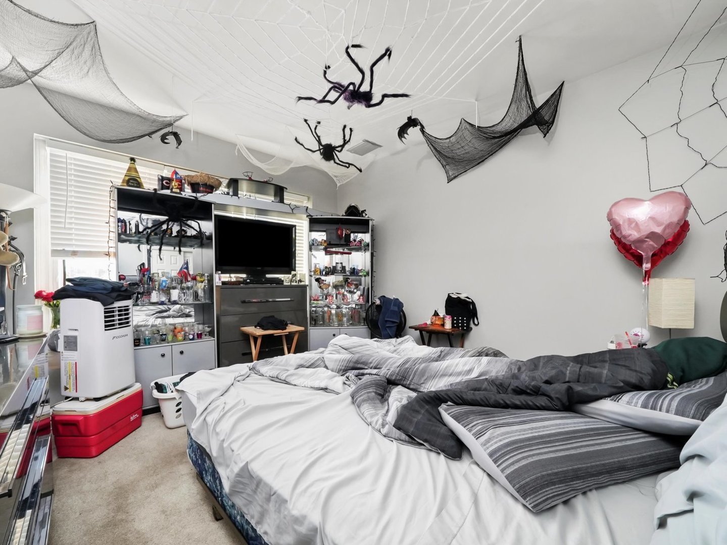 5758 West 65th Street Chicago, IL 60638 - Photo 25 of 33 a bedroom with a bed and a flat screen tv