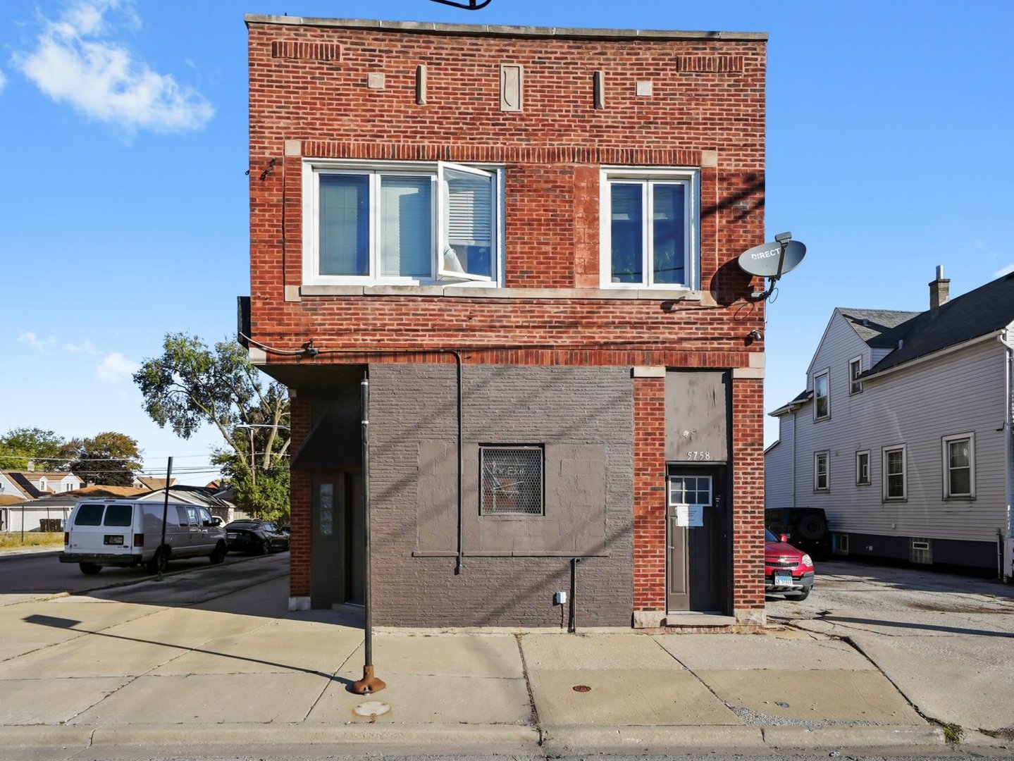5758 West 65th Street Chicago, IL 60638 - Photo 4 of 33 a front view of a house with a yard