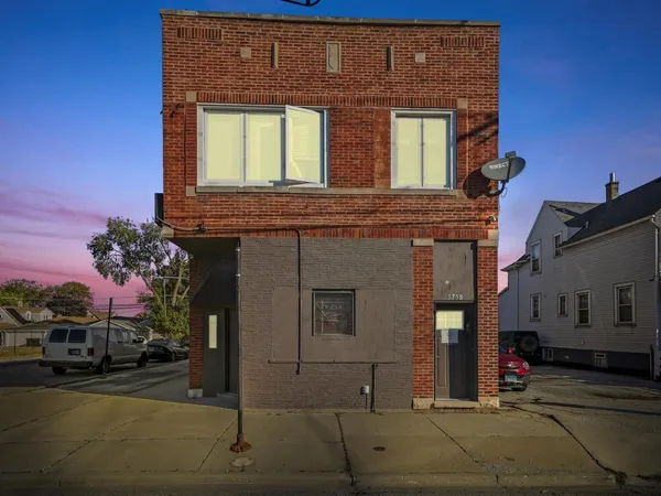 a view of a house with a street
