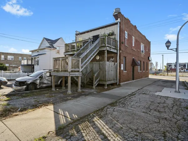 a view of a building with a yard