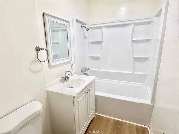 a bathroom with a shower curtain and a bathtub