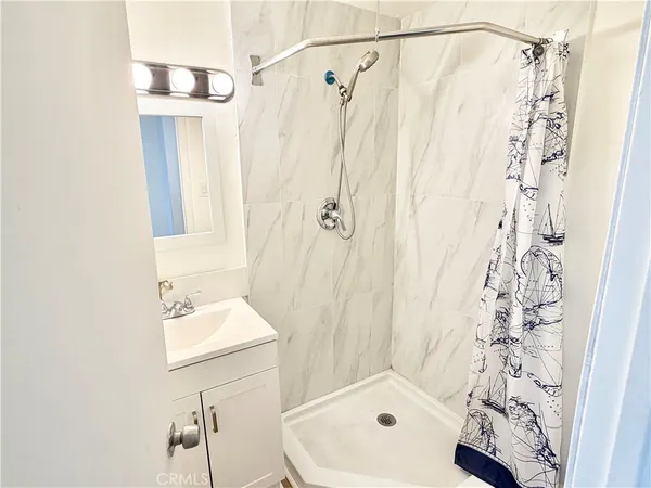 a bathroom with a sink and a shower