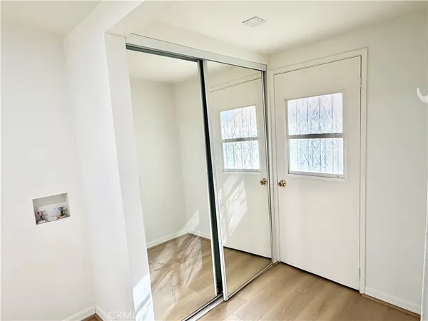 a kitchen with stainless steel appliances a refrigerator a sink a stove and cabinets