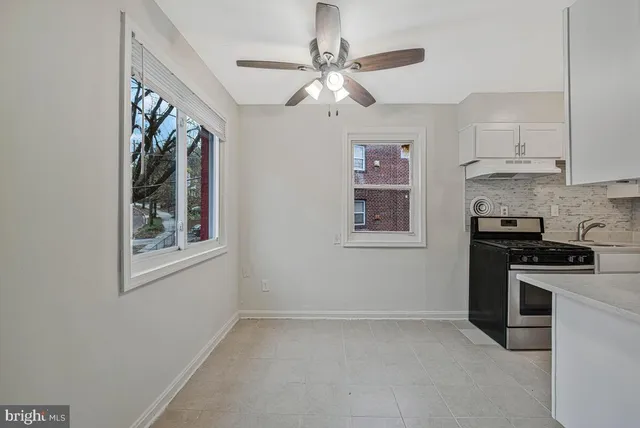 a kitchen with a stove and a refrigerator