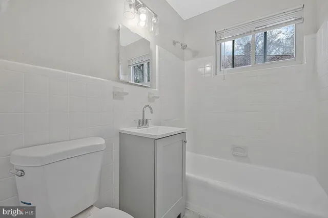 a view of a wooden door and a tree