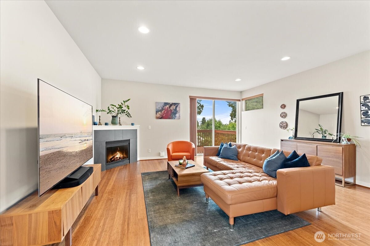 12418 2nd Place Southwest Burien, WA 98146 - Photo 2 of 39 a living room with furniture and a fireplace