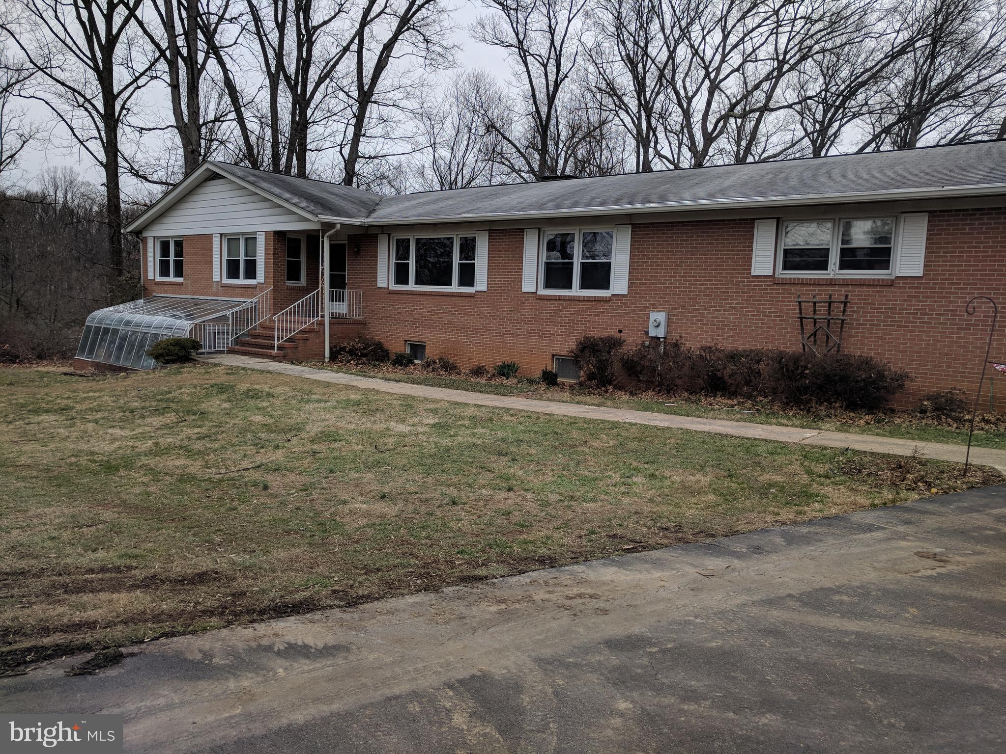 17332 Donora Road Silver Spring, MD 20905 - Photo 2 of 18 a front view of a house with garden