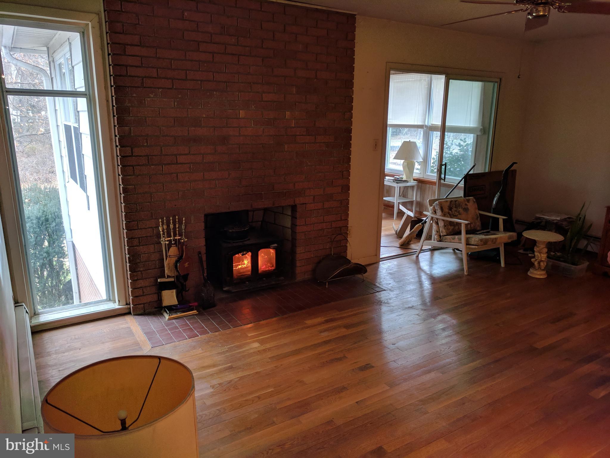 17332 Donora Road Silver Spring, MD 20905 - Photo 12 of 18 a living room with furniture window and wooden floor
