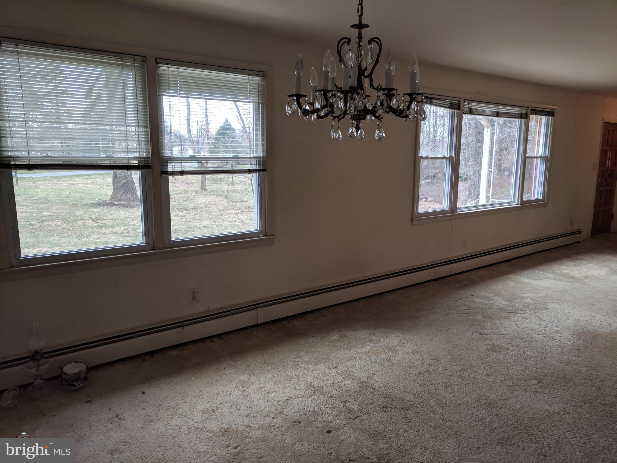 17332 Donora Road Silver Spring, MD 20905 - Photo 14 of 18 a view of an empty room with a window