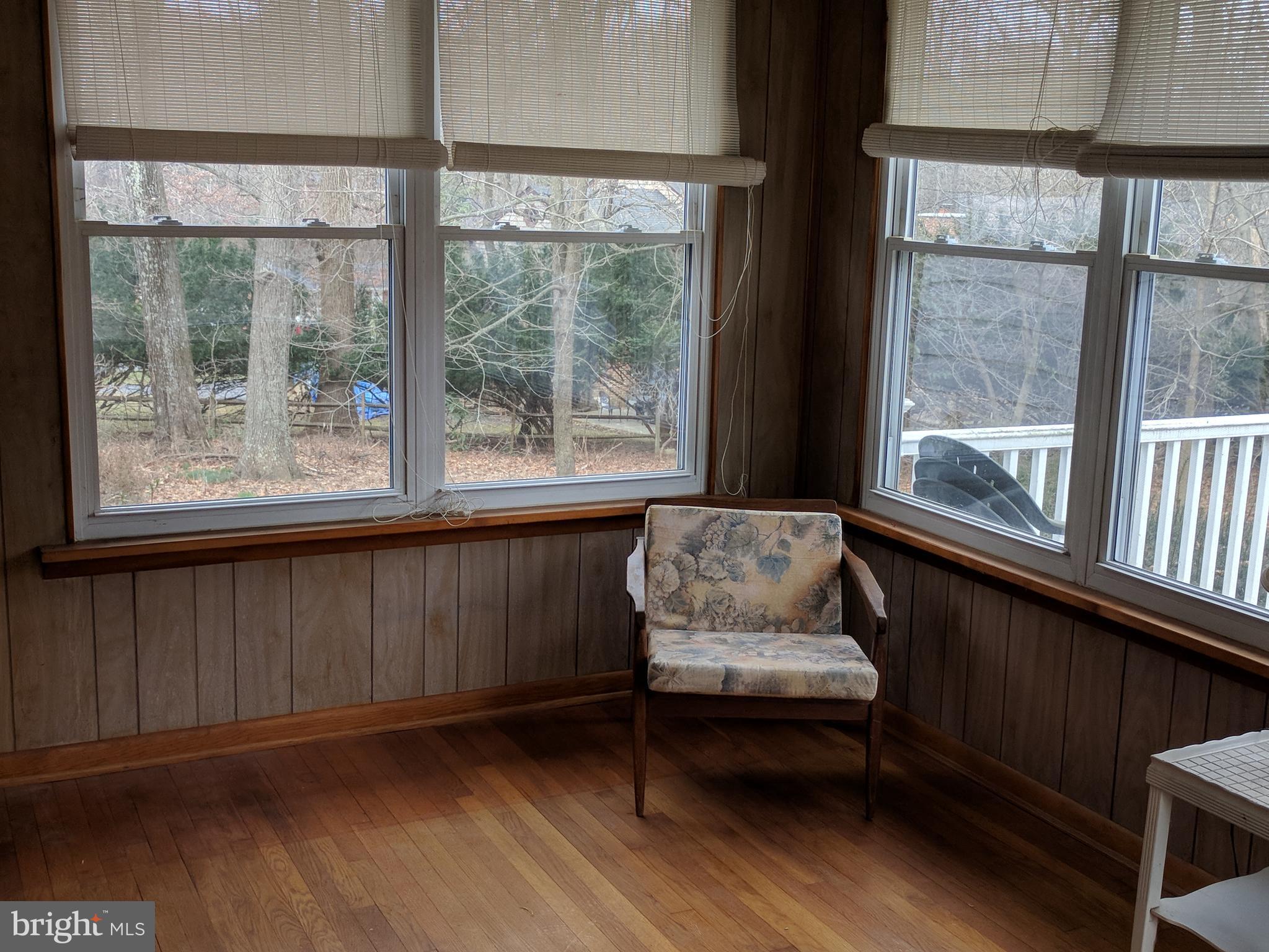 17332 Donora Road Silver Spring, MD 20905 - Photo 16 of 18 a living room with furniture and a window