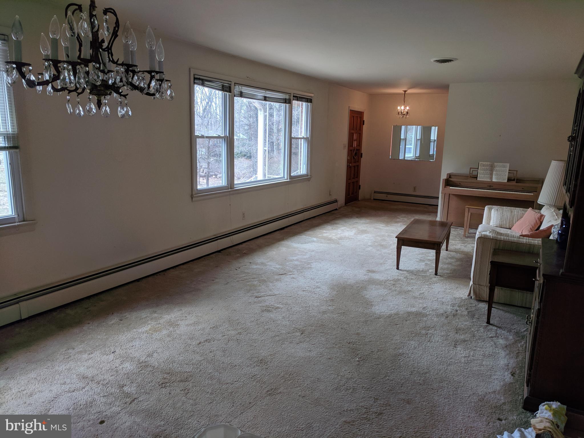17332 Donora Road Silver Spring, MD 20905 - Photo 18 of 18 a living room with furniture and a window