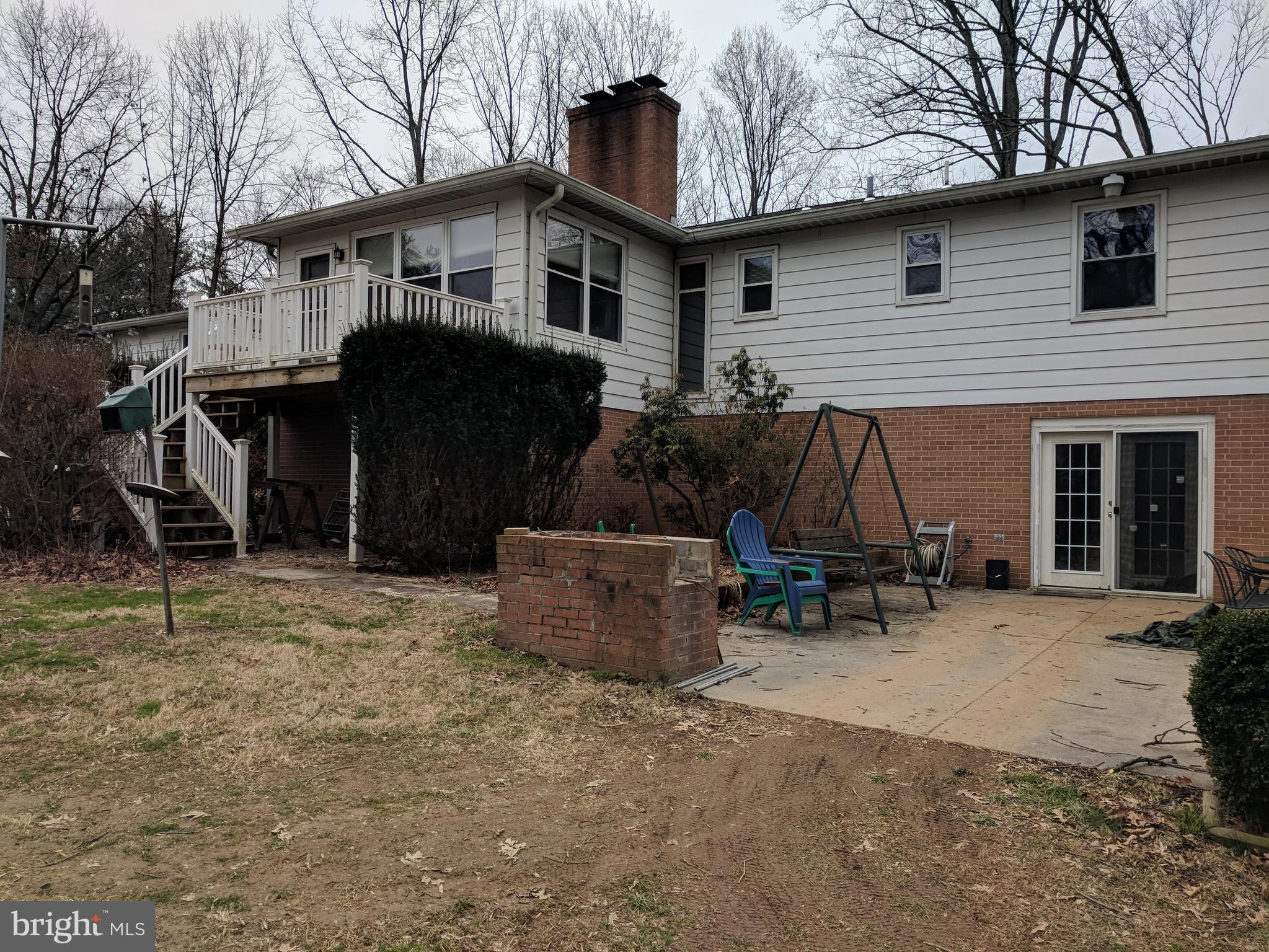17332 Donora Road Silver Spring, MD 20905 - Photo 3 of 18 a view of a house with a patio and a yard