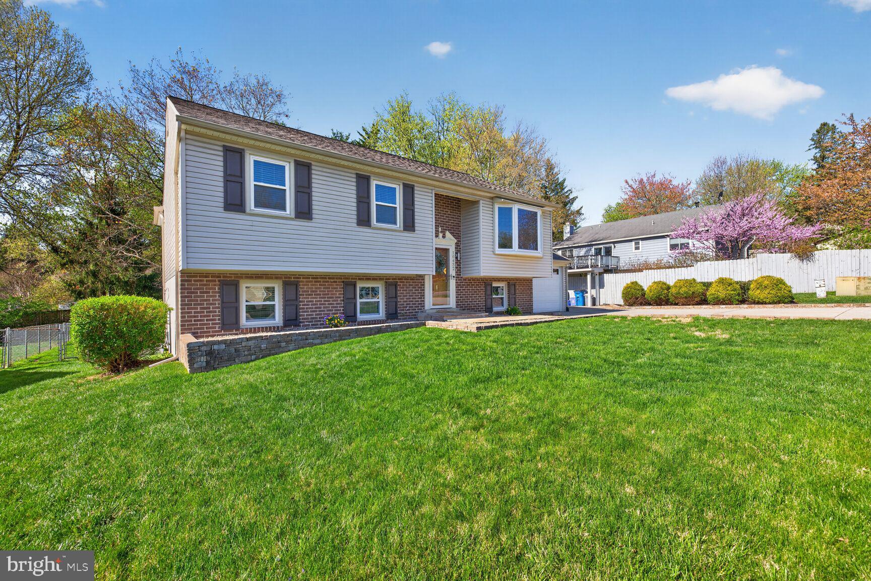 10432 Sweepstakes Road Damascus, MD 20872 - Photo 1 of 1 a house view with a garden space