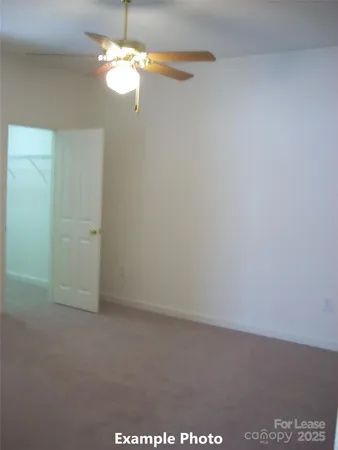 a view of a chandelier fan in a room