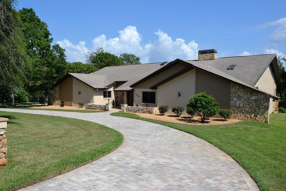 7828 Floral Drive Weeki Wachee, FL 34607 - Photo 1 of 1 Front of House with Paved Circular Driveway