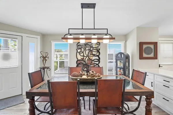a dining room with furniture and window