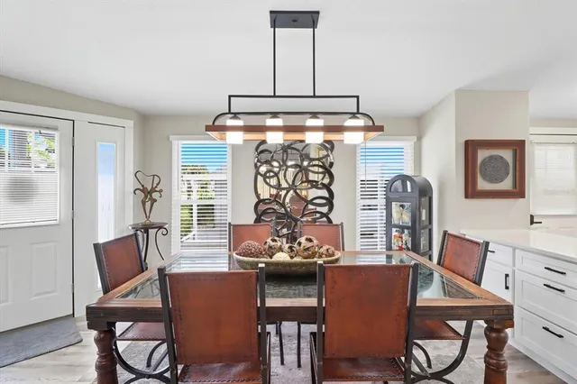 a dining room with furniture and window