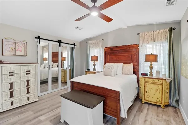 a bedroom with a bed and a cabinets