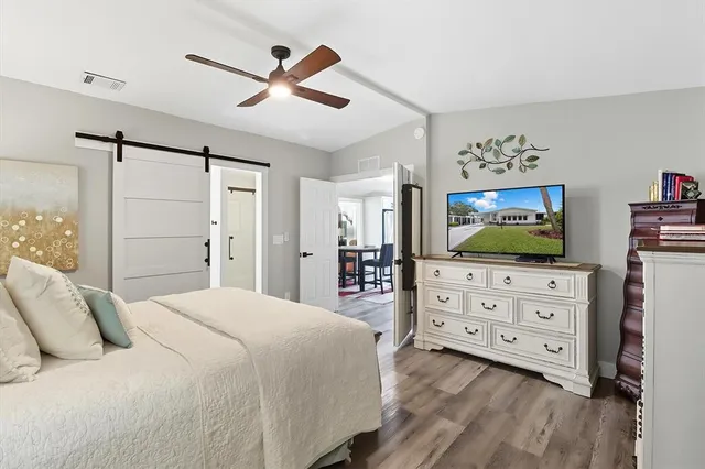 a bedroom with a bed and a dresser