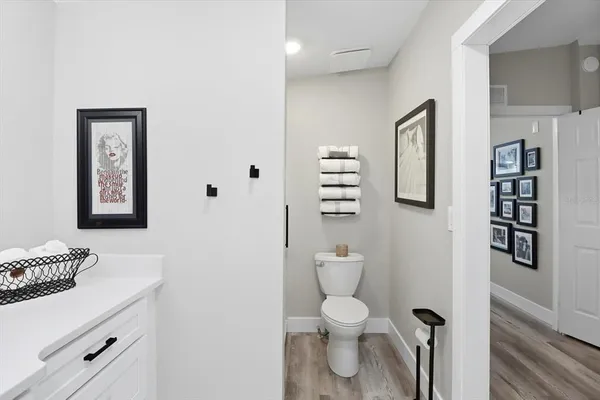 a white toilet sitting next to a bathroom sink