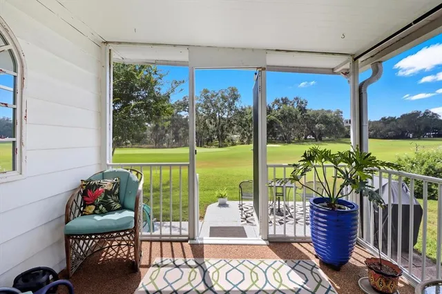 a view of a porch with furniture