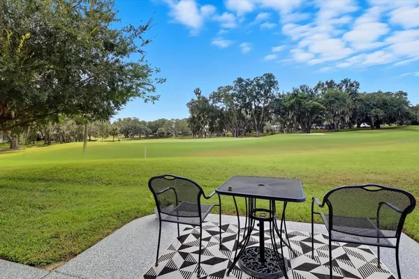 a view of swimming pool and outdoor seating