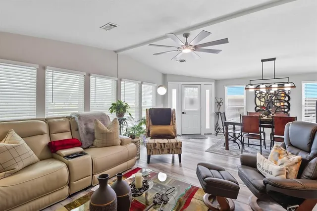 a living room with furniture and a large window
