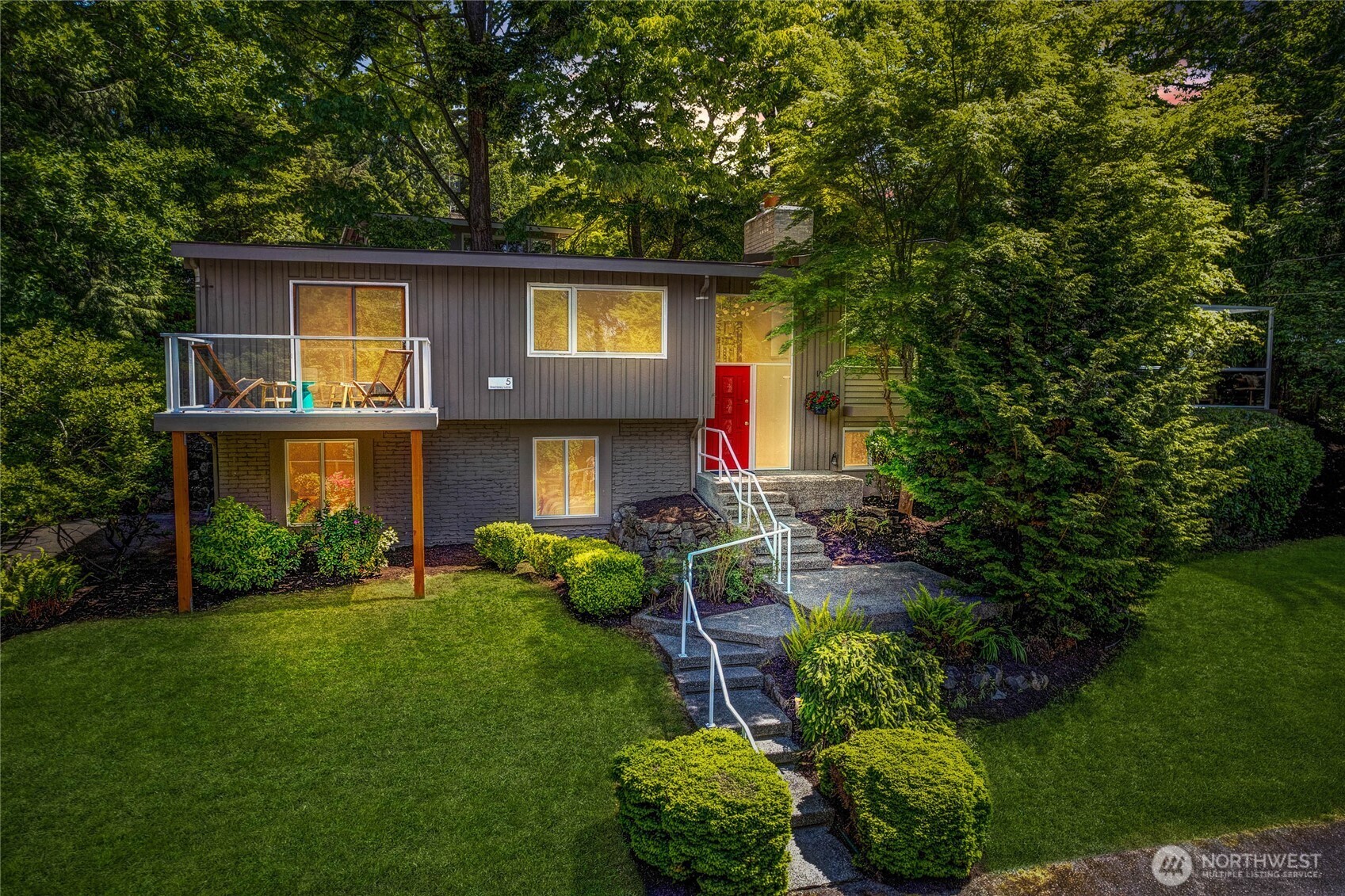 5 Wembley Lane Mercer Island, WA 98040 - Photo 1 of 40 a front view of a house with a yard fire pit and outdoor seating