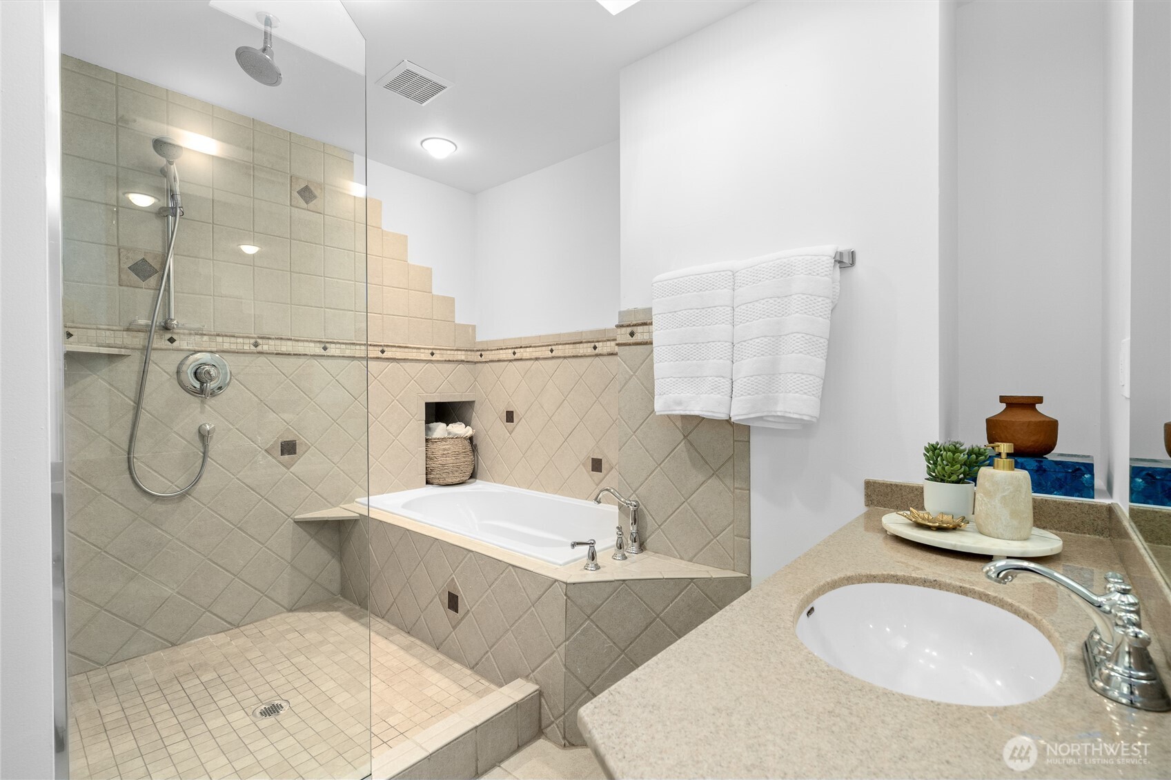 5 Wembley Lane Mercer Island, WA 98040 - Photo 15 of 40 a bathroom with a granite countertop sink a toilet and shower