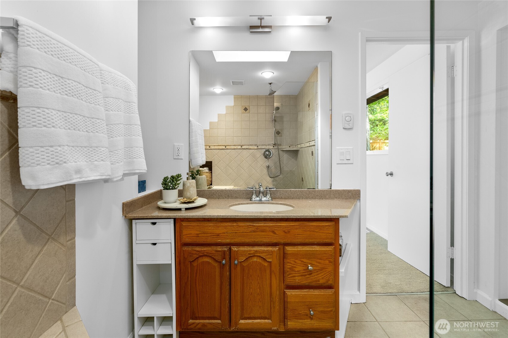 5 Wembley Lane Mercer Island, WA 98040 - Photo 16 of 40 a bathroom with a granite countertop sink a toilet and a mirror