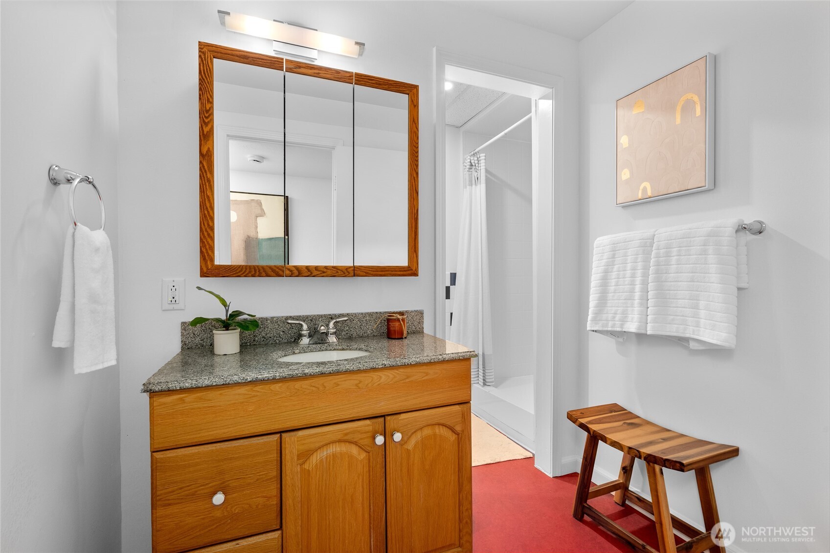 5 Wembley Lane Mercer Island, WA 98040 - Photo 28 of 40 a bathroom with a sink a light fixture and a mirror