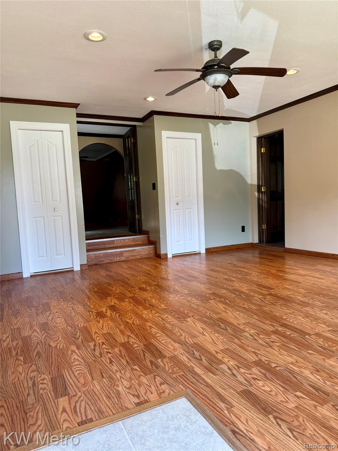 5982 South Mission Road Mount Pleasant, MI 48858 - Photo 4 of 32 Spare room featuring ornamental molding, wood finished floors, a textured ceiling, recessed lighting, and a ceiling fan