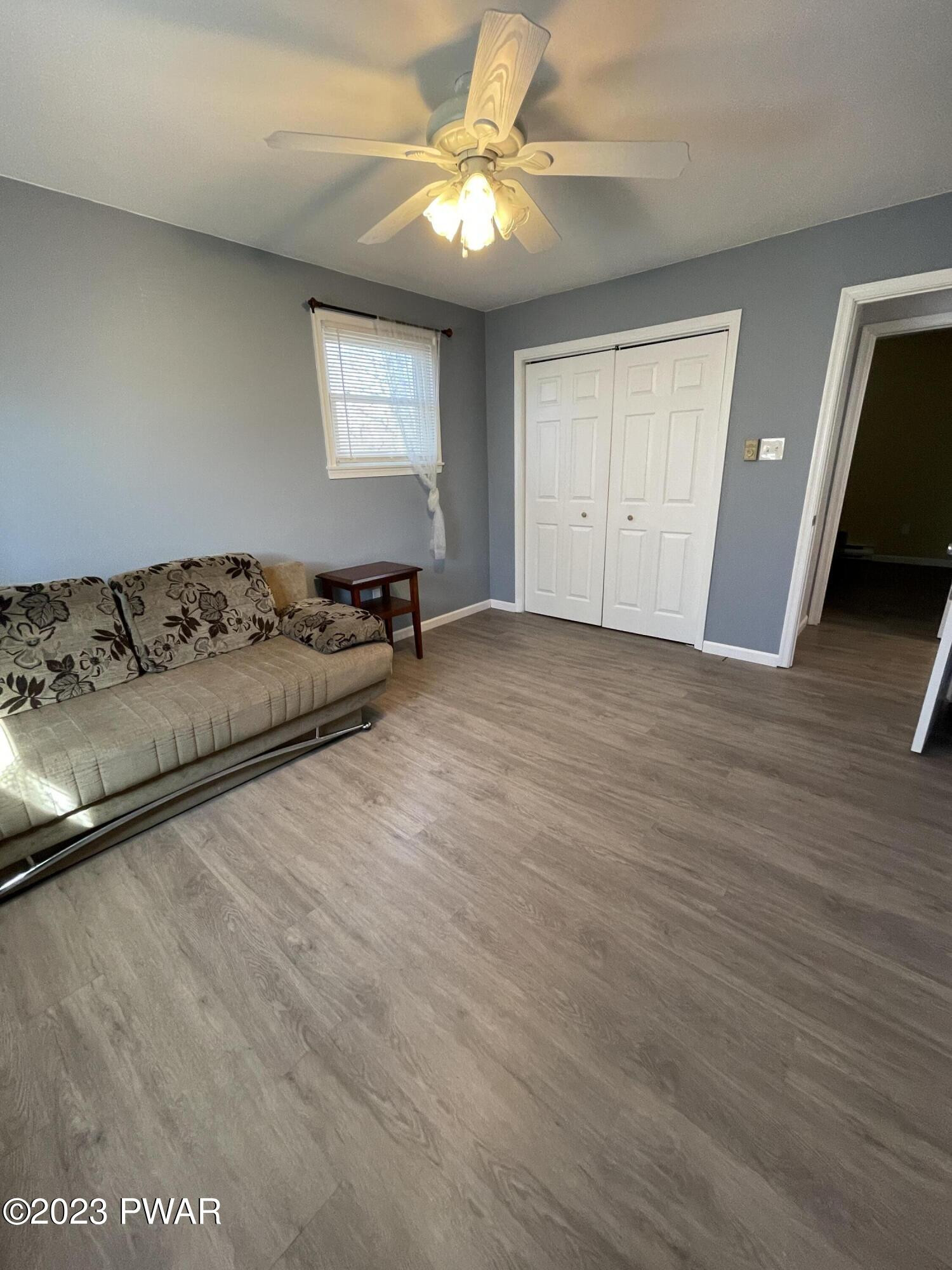 146 Roundhill Road Dingmans Ferry, PA 18328 - Photo 41 of 53 a view of a livingroom with a couch