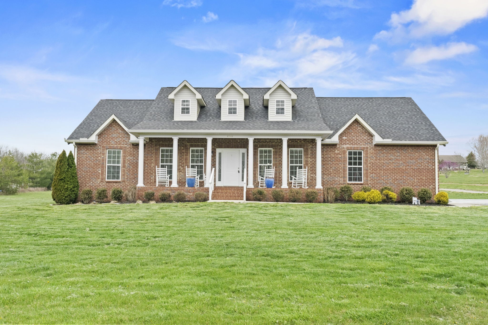 2712 Henry Gower Road Pleasant View, TN 37146 - Photo 3 of 44 a front view of a house with a garden