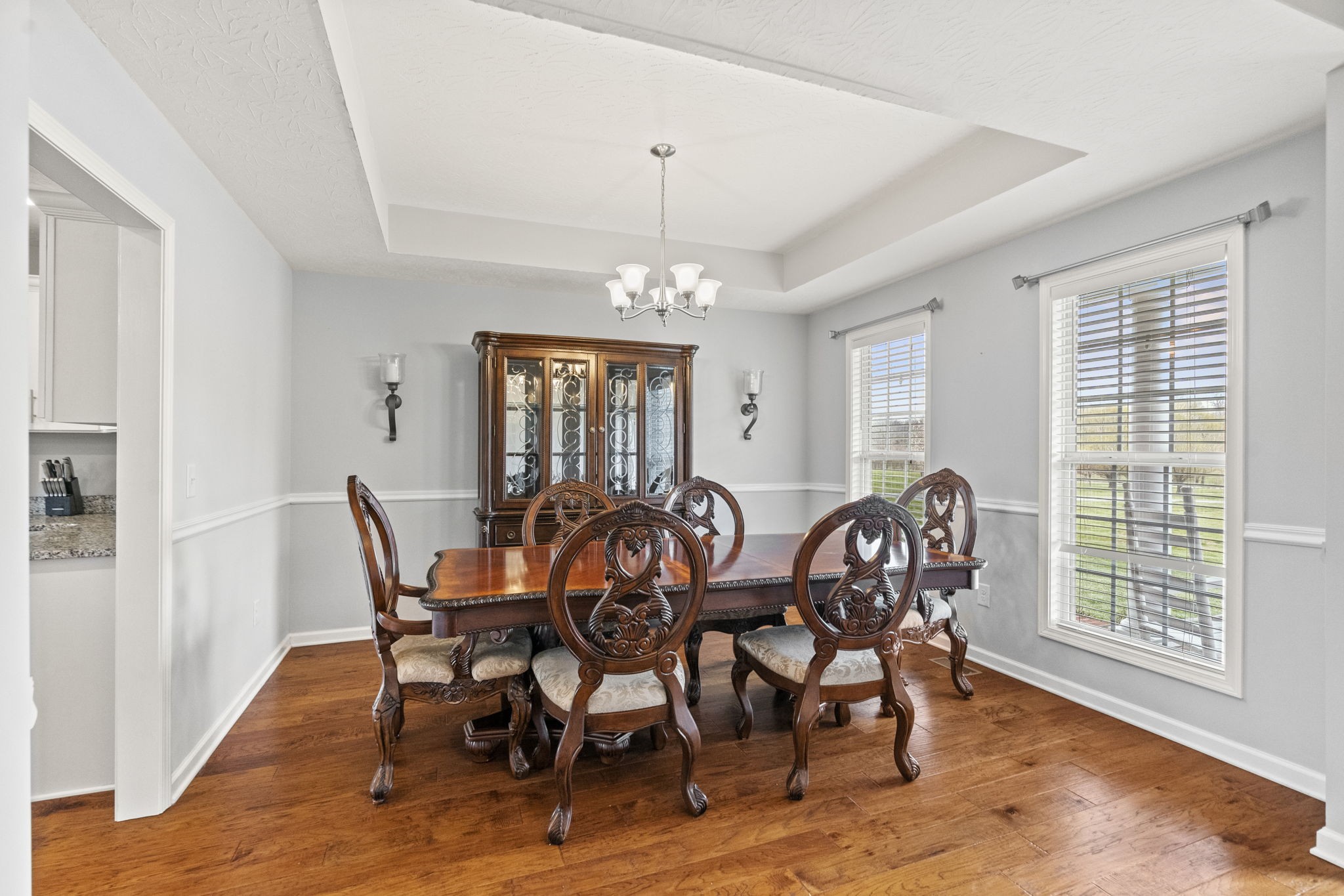 2712 Henry Gower Road Pleasant View, TN 37146 - Photo 8 of 44 a view of a dining room with furniture and wooden floor