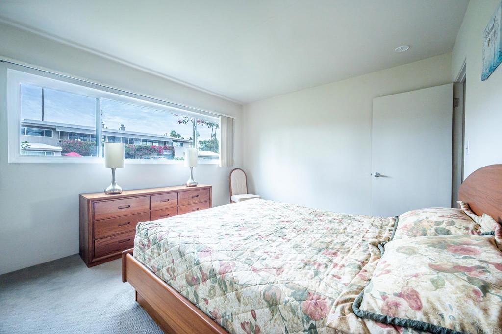 69850 Highway 111, Unit 18 Rancho Mirage, CA 92270 - Photo 22 of 41 a bedroom with a bed and window