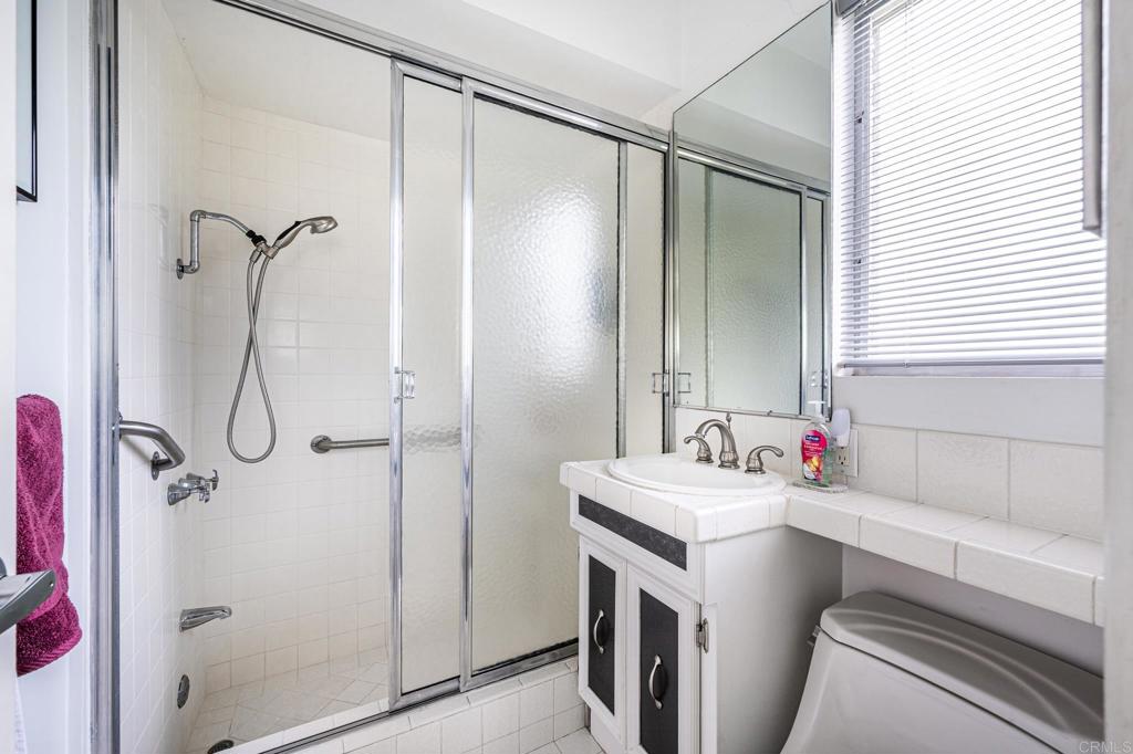 69850 Highway 111, Unit 18 Rancho Mirage, CA 92270 - Photo 23 of 41 a bathroom with a sink vanity mirror and shower