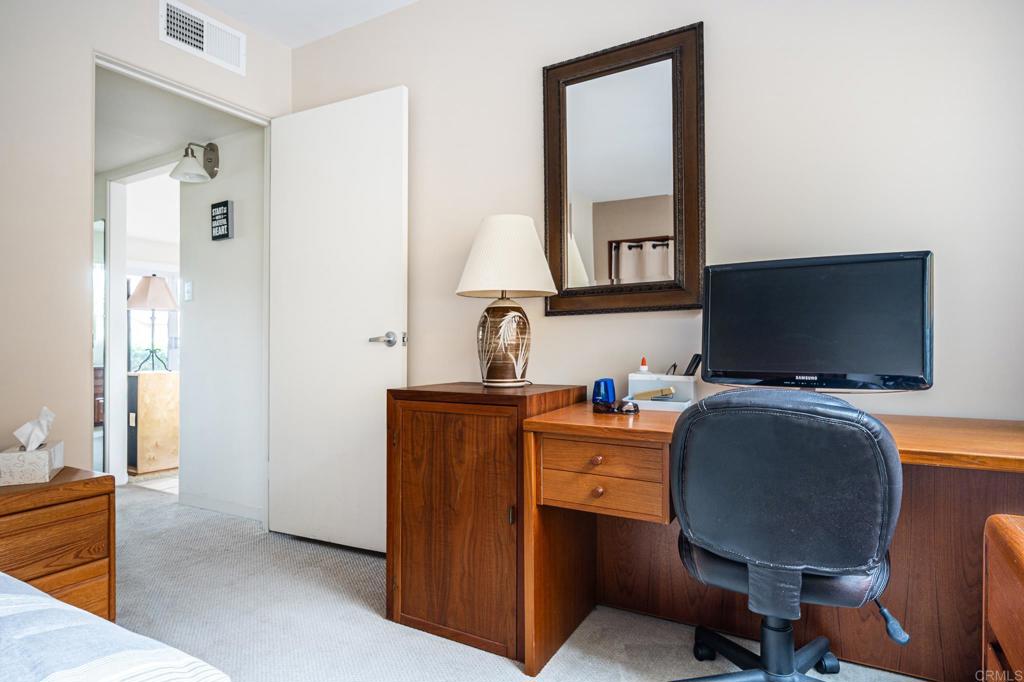 69850 Highway 111, Unit 18 Rancho Mirage, CA 92270 - Photo 26 of 41 a workspace with furniture and mirror