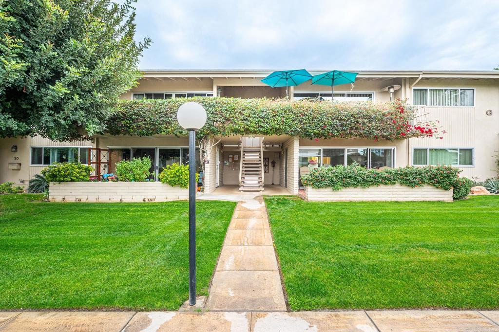 69850 Highway 111, Unit 18 Rancho Mirage, CA 92270 - Photo 36 of 41 a front view of a house with garden