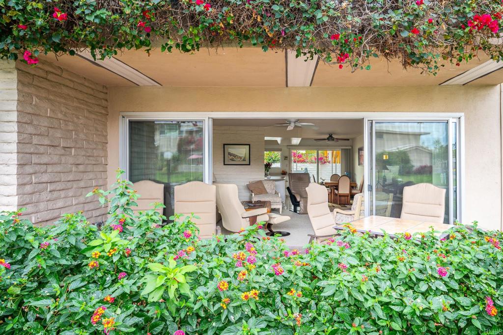 69850 Highway 111, Unit 18 Rancho Mirage, CA 92270 - Photo 5 of 41 a view of a patio with table and chairs and potted plants