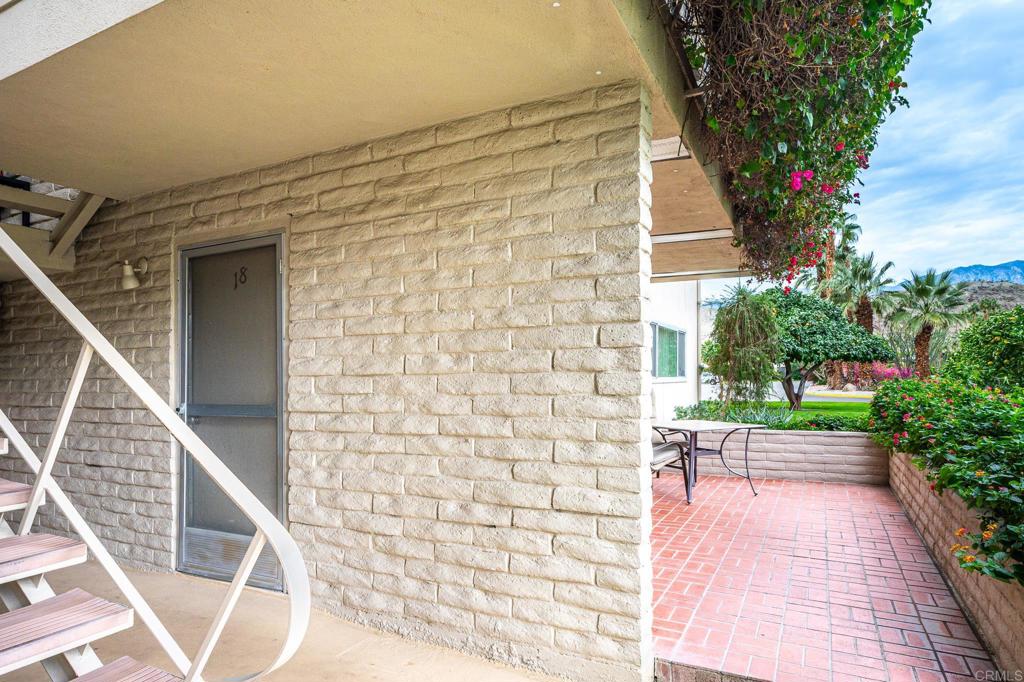 69850 Highway 111, Unit 18 Rancho Mirage, CA 92270 - Photo 6 of 41 a view of a porch with wooden floor and fence