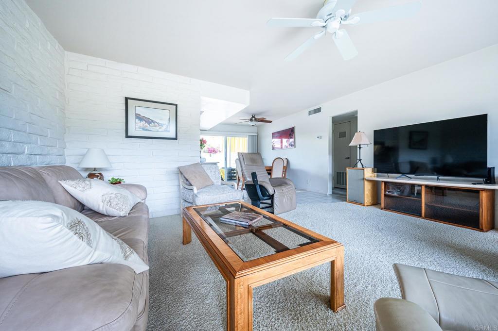 69850 Highway 111, Unit 18 Rancho Mirage, CA 92270 - Photo 10 of 41 a living room with furniture and a flat screen tv