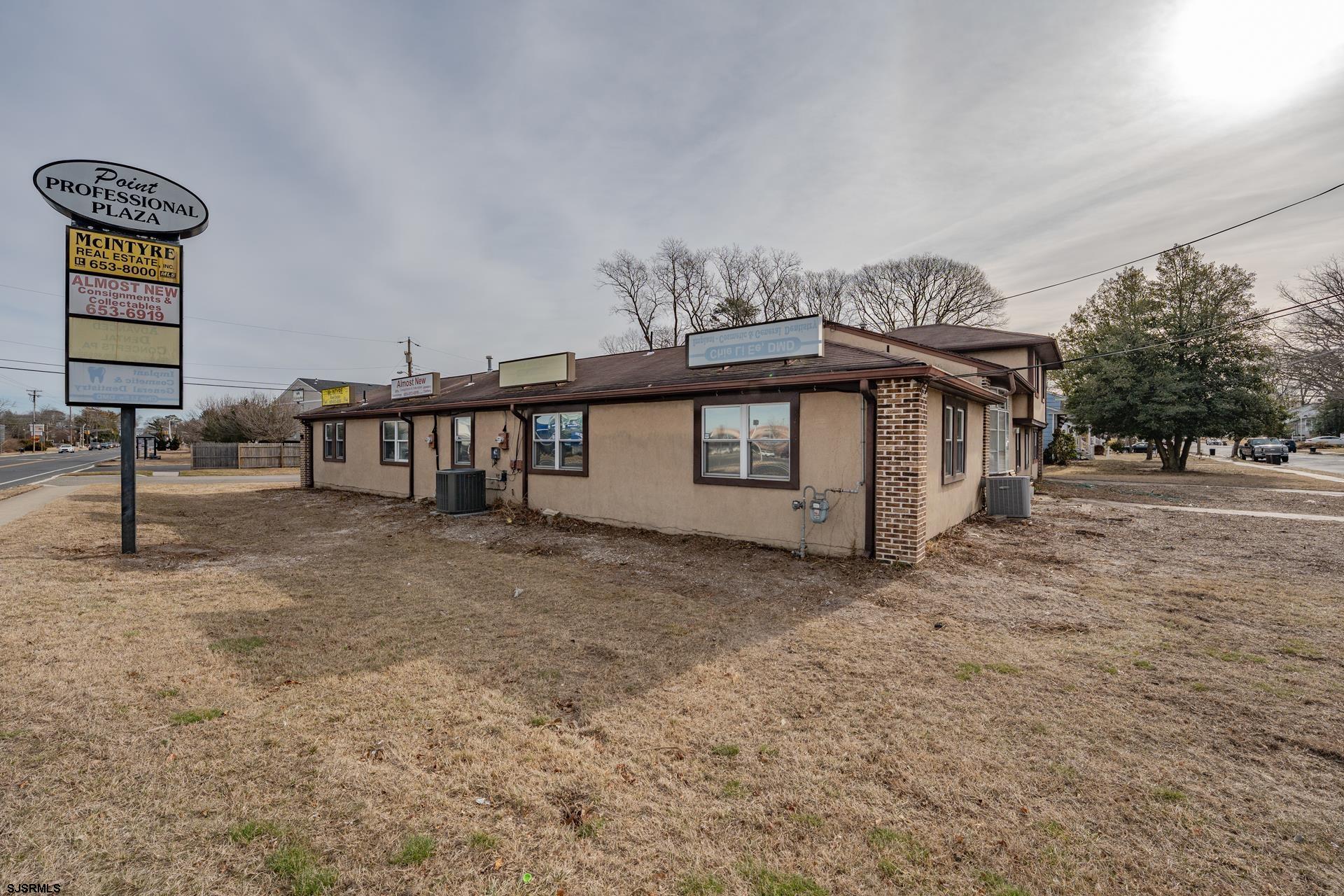 a view of a porch with a table and chairs