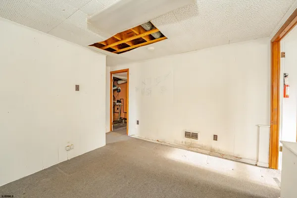 a view of a room with a hallway