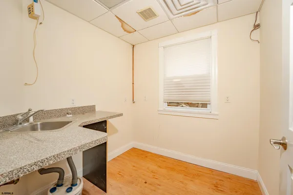 a view of a hallway with a white walls