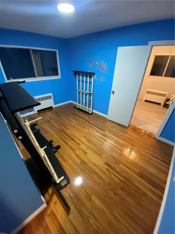 a view of workspace with wooden floor