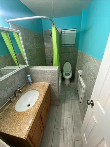 a bathroom with a sink and mirror
