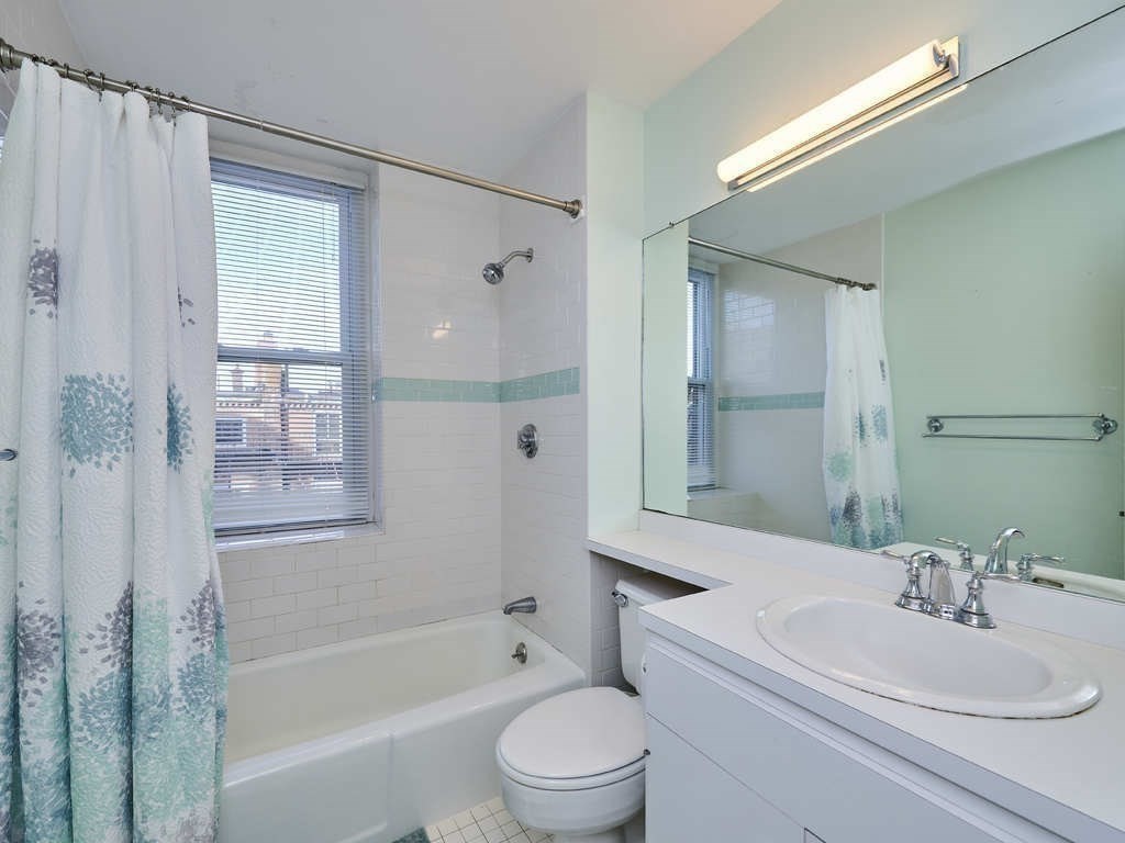65 Pinckney Street, Unit 3 Boston, MA 02114 - Photo 11 of 14 a bathroom with a sink toilet and shower