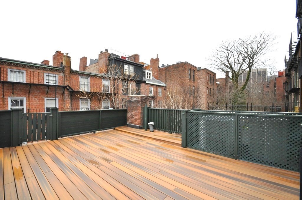 65 Pinckney Street, Unit 3 Boston, MA 02114 - Photo 12 of 14 a terrace of a house with wooden floor