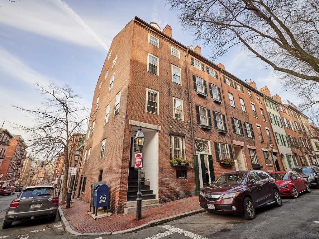 65 Pinckney Street, Unit 3 Boston, MA 02114 - Photo 14 of 14 a car parked in front of a building